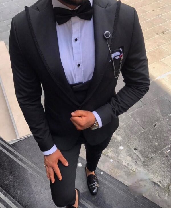 Men's Black Tuxedo with Bow Tie and Chain Accent – Sleek Formalwear for Special Occasions